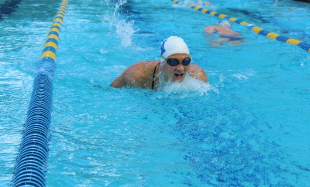 Senior+Gina+Dillulo+warms-up+for+the+SAC.+She+placed+9th+in+the+200+yard+IM+shortly+after.