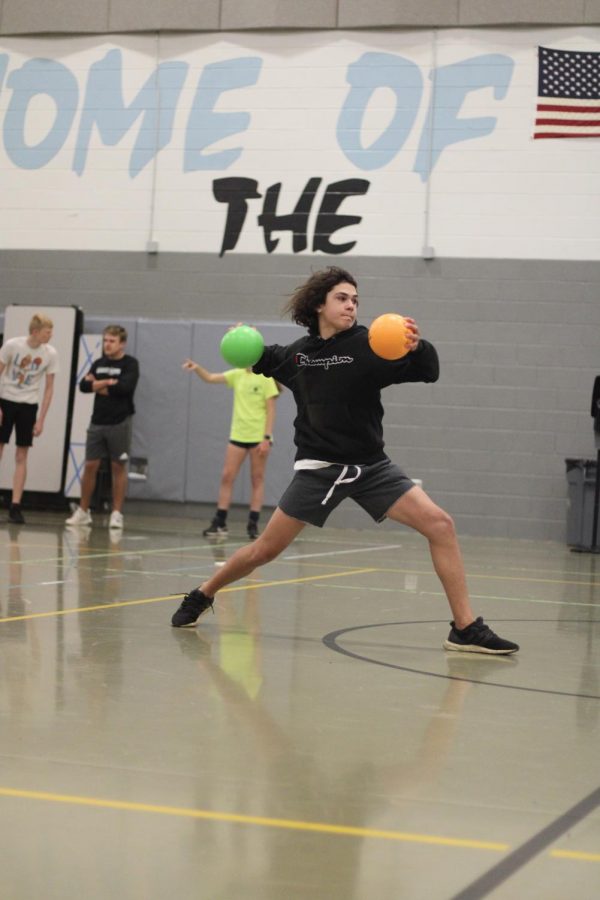 Freshman+Carson+Turner+takes+aim+at+the+opposing+team+in+the+dodgeball+tournament.+Students+were+determined+to+defeat+their+opponents.