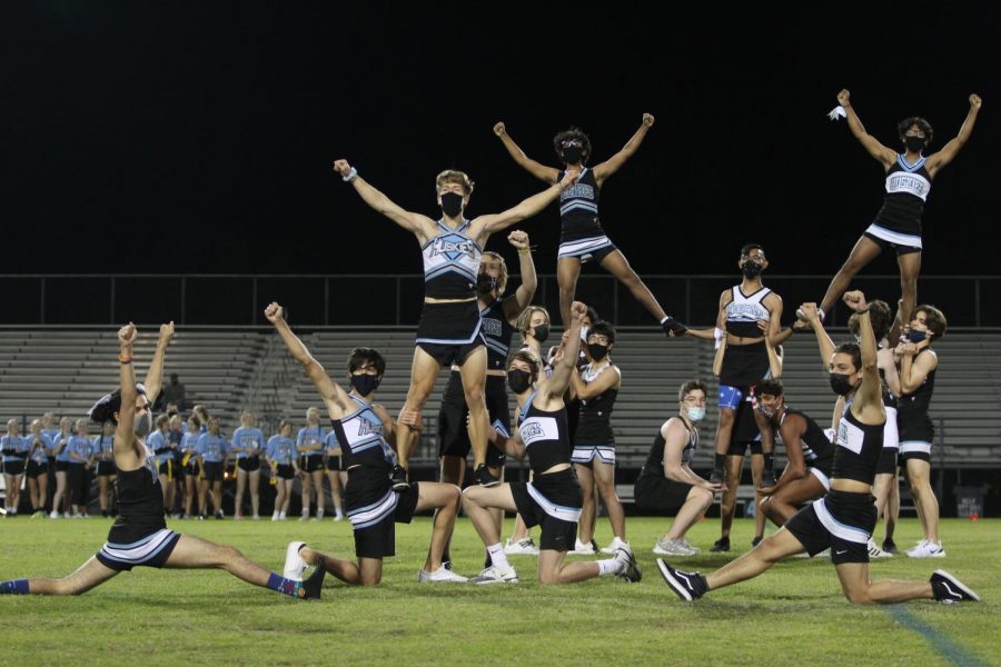Senior cheerleaders end their final homecoming week by performing their cheer routine during the third quarter of Powderpuff. 