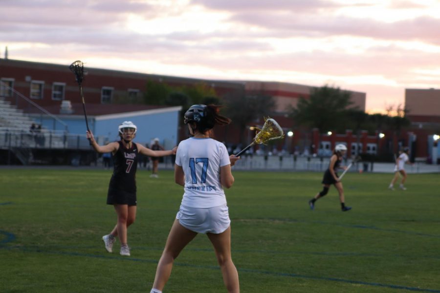 Attacker Ellie Wilkins looks to pass during the senior night game against Lake Mary Prep. 
