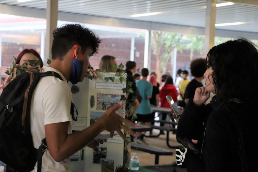 Senior Edward Collazo-Borges talks to students about the important work done by the Environmental Club. Many club leaders and members around campus talked to students about the mission statements and workloads of their organizations.

