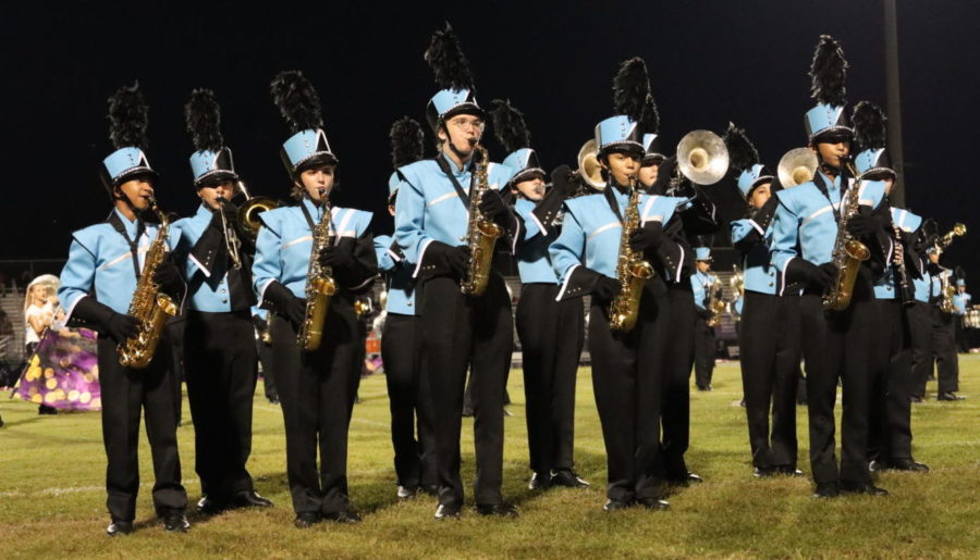 The saxophones and trombones play during the Winter Springs half time. On Sept. 10, the group played Queen songs Dont Stop Me Now and Fat Bottomed Girls.