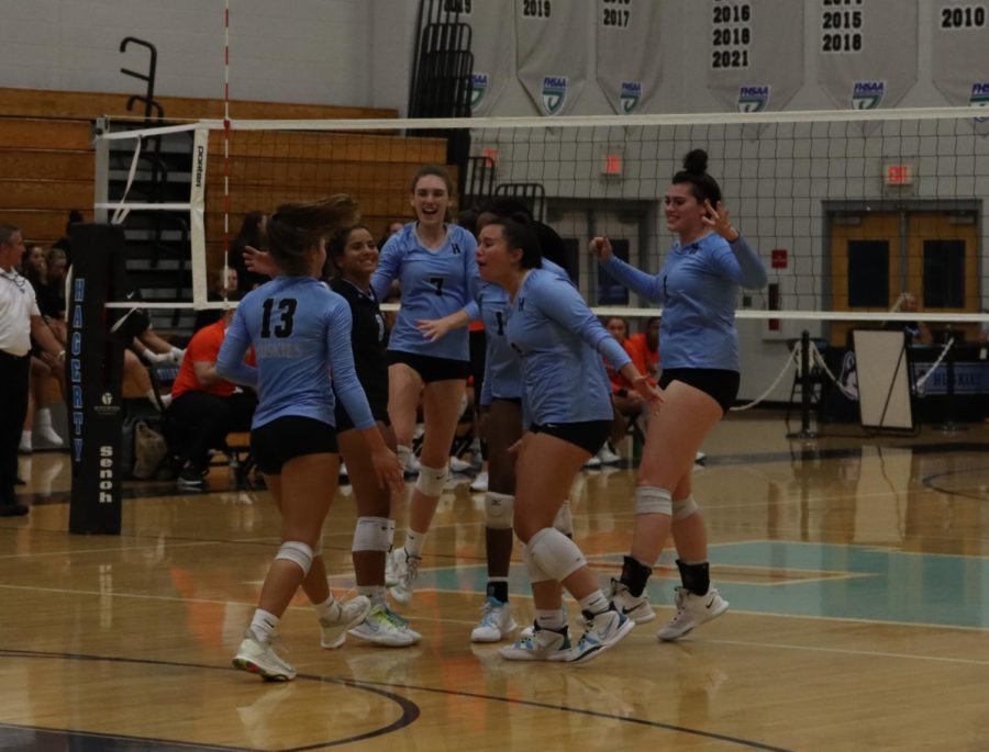The varsity girls volleyball team celebrate after outside hitter Brooke Stephens gets the kill. The team then proceeded to win against Oviedo.