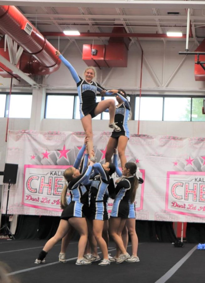The varsity cheer team participates in one of their first competitions on Nov. 11. The team was later named grand champs.