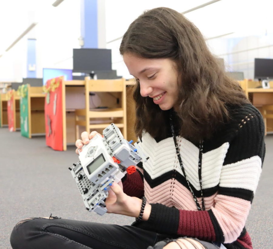 Junior Ilani Seguinot evaluates an EV3 robot built by the Minimancer First Lego League Challenge Team. Seguinots interest in STEM was initially sparked by her participation in the Geneva Elementary School robotics program. 
