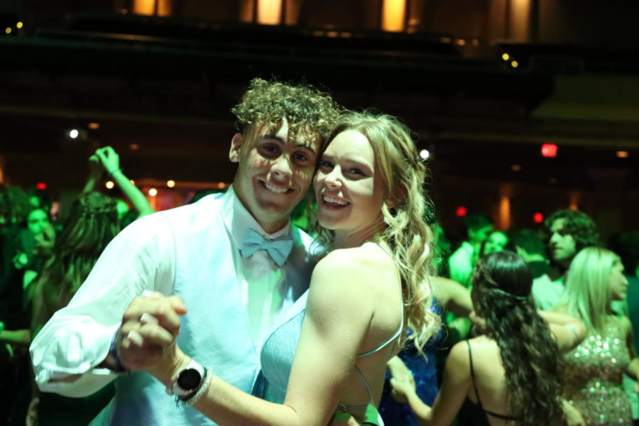 Junior Frankie Mentlick and senior Erin Road dance together during prom. While the night consisted mainly of popular hit songs, a few slow songs were played as well.