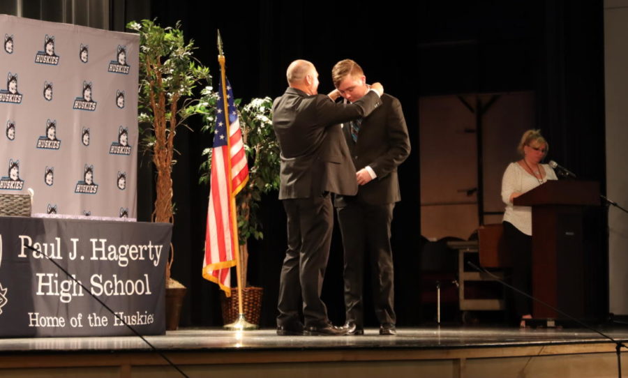 Senior Cade Rogers receives his honor medal from principal Frasca. He is a part of the largest group of honor grads in school history. 