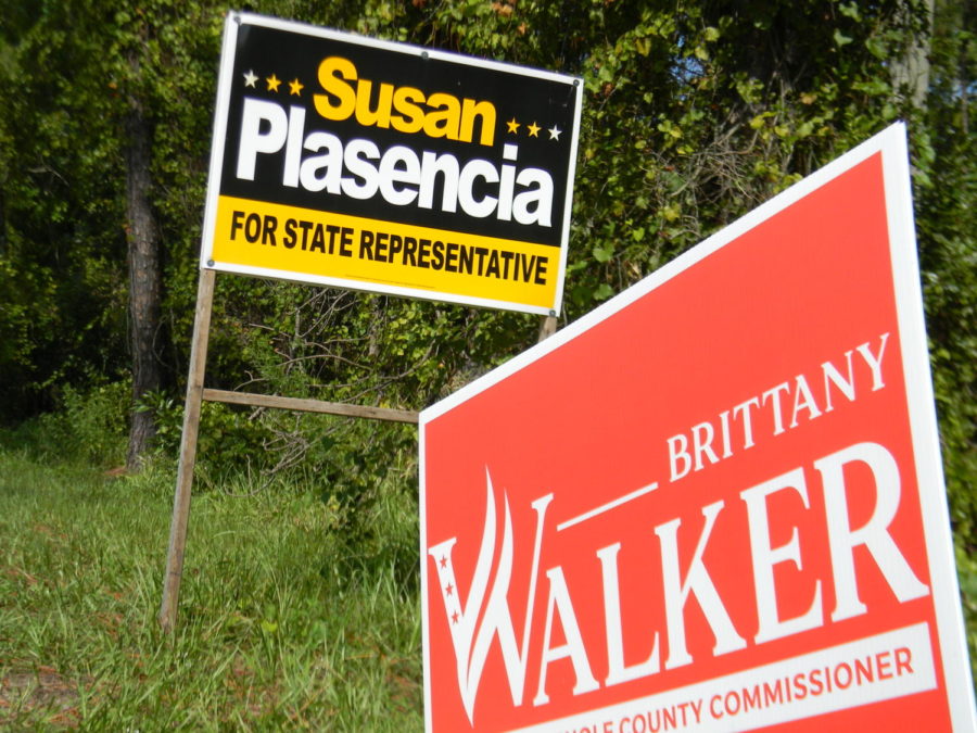 Political signs for state representative and county commissioner candidates stand on the side of Lockwood Blvd. In order to show good faith and abide by state law, all candidates’ signs must be removed within 30 days of being elected to office, being eliminated from the race or withdrawing their candidacy.