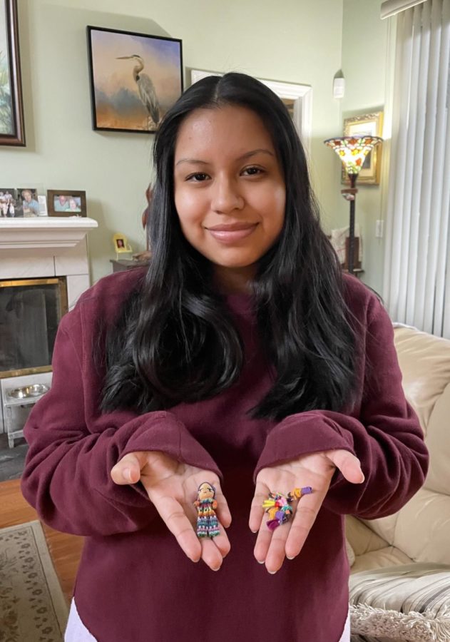 LaBarbera poses with her worry dolls. Sometimes I dont want to bother other people, so its like I always have someone who can listen to me, LaBarbera said. 