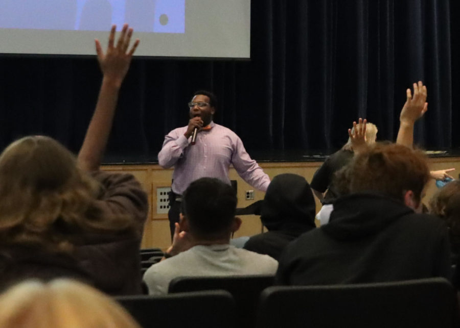 Assistant Principal Reggie Miller quizzes students on what PRIDE stands for (Punctuality, Respect, Integrity, Dependability, Excellence). Students were awarded with Hagerty merch if they answered correctly. 