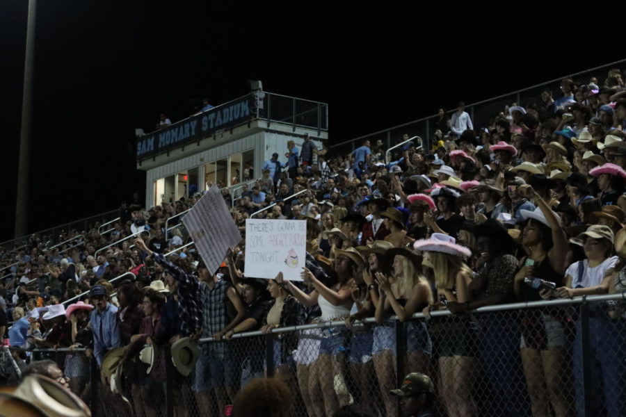 The student section cheers on the footballteam in a 45-7 blowout win against East River. Delays and cancelations have been prevalent earlier in the season which will be rare with the turf field.