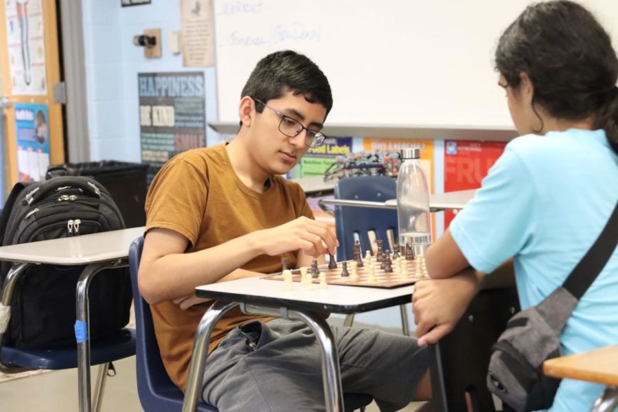 Chess Club member Franco Fernandez decides how to place his next piece strategically against his partner. Chess Club meetings will be held Mondays after school in room 4-113. 
