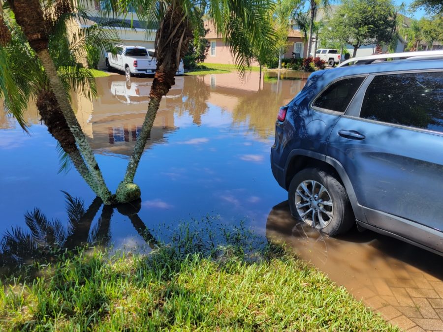 Principal Robert Frascas street floods days after Hurricane Ian passes. The water trapped his car in his driveway until Monday morning after the flooding receded. 