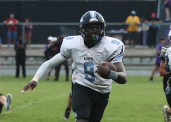 Running back Anthony White is running the ball against Winter Springs. He had 37 total rushing yards. 