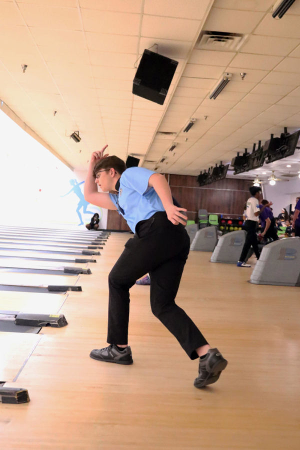 Junior Dillon Dunn stays in his bowl form after throwing his ball. This is his first year on the bowling team.