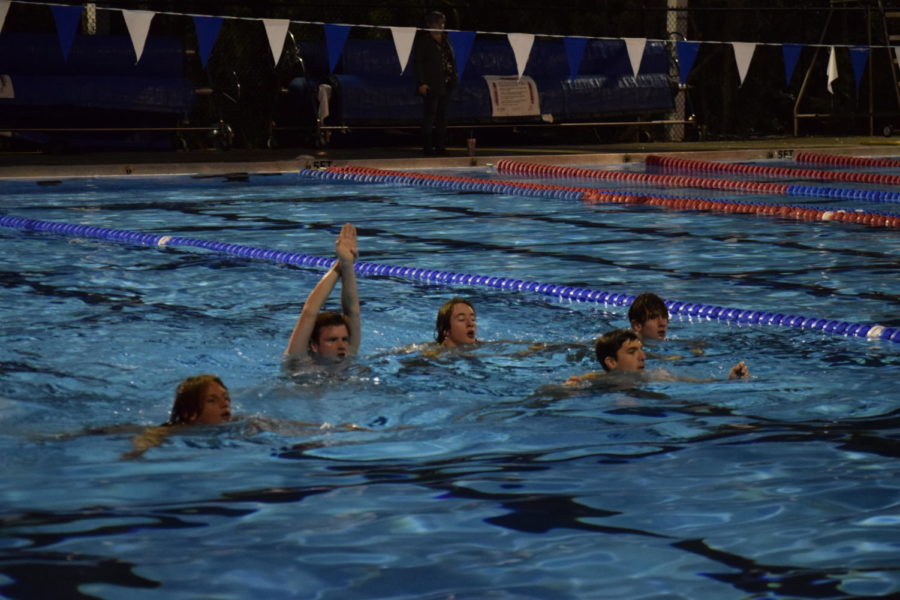 The boys water polo team do conditioning drills. The team hopes to improve on a disappointing season from last year. 