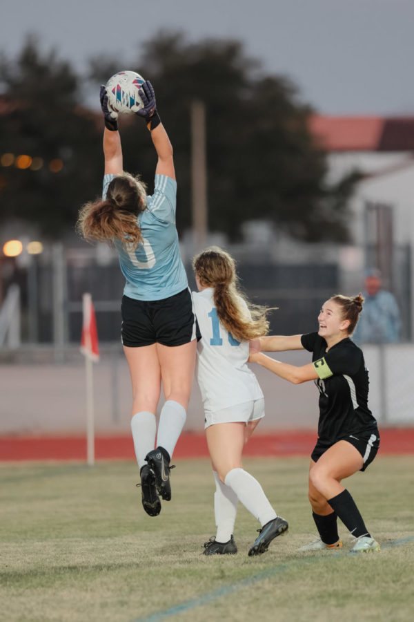 Goalie Aryana Rosenblum saves the ball in overtime as Timber Creek inches closer to the goal. The team took home the district title against Timber Creek after scoring three penalty kicks. 