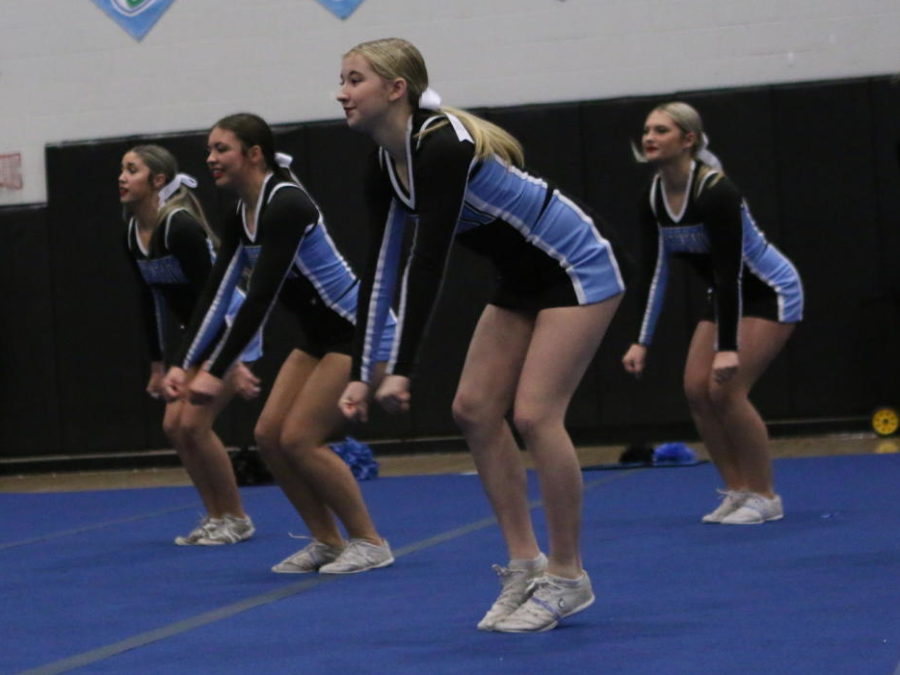 Freshman Scarlett Isaacs and her teammates of the varsity cheer team compete at the Hagerty Cheer Challenge. The team took first at the event, and later took second at states and sixth at nationals.