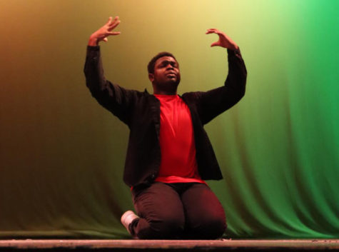 Senior Jamason Belgrave dances passionately as one of the first acts in the Black Student Unions first inaugural Black History Month showcase. The event is the first of its kind held by the organization.