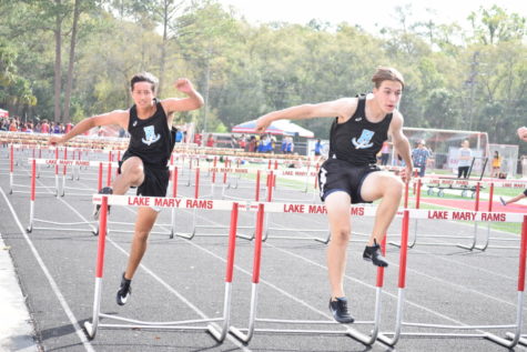 Juniors Alex Watson and Kade Law go jump for jump with each other in the 110 meter hurdles. The boys team ended up finishing 4th overall.
