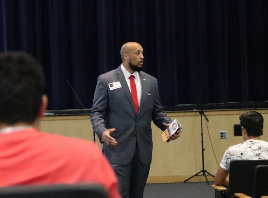 Florida Supervisor of Elections Chris Anderson speaks to students about the importance of voting and his experiences in the army. Students were able to register to vote at the seminar or pre-register if they were under 18-years-old. 