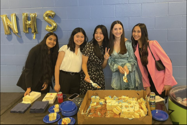(from left to right) NHS treasurer Anouska Seal, president Cheryl Nguyen, vice president Katie Pham, secretary Nadia Knoblauch and historian Jenna Hecker pose for a photo at the induction ceremony. The officers were newly inducted on April 10. 