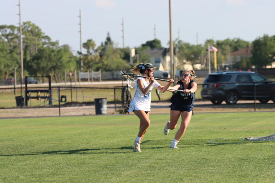 Attacker Ella Digiore is about to pass the ball to her teammate. The team went on to beat the nationally ranked team 9-7. 