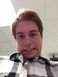 Senior Tyler Copeland preserves his funny face for years to come on his camera roll with another in-class selfie