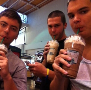 Mocking the stereotypical "white-girl," these Starbucks-sporting students snap a quick pic.