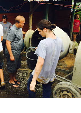 Agua Viva director Blake Davidson and junior Patrick Finster confirm a batch of cement has the correct proportions of sand and water.  Mixing cement was the job Finster enjoyed most at the work site.