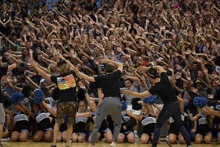 Roller coaster ride. Senior student section leaders Zach Navicky, Josh Mohammed and Brenden Carillo lead students in the Roller Coaster activity at the Sept. 11 pep rally.