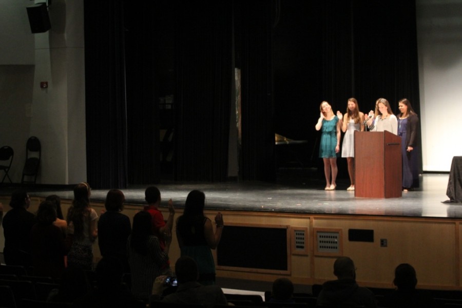 Attendees are sworn into the National Beta club during a ceremony.