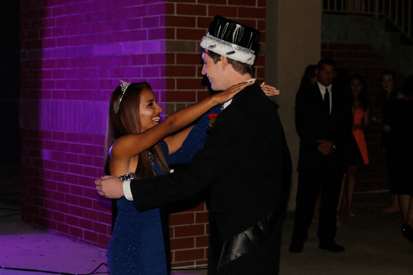 Homecoming king, senior Jason Donnelly, and homecoming queen, senior Isabella Guevara, slow dance to the Maroon 5 song She Will Be Loved surrounded by students during Saturdays dance.