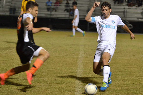 Senior Zach Weishampel passes the ball versus Oviedo. The team won 7-1.