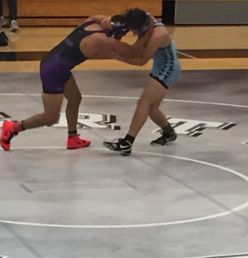 Junior+Oliver+Hart+wrestles+against+the+seventh+ranked+wrestler+in+the+152-pound+weight+class+in+the+state+for+Timber+Creek.+The+team+defeated+Timber+Creek+41-31.