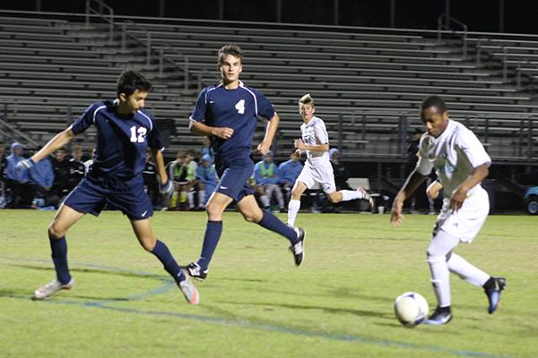Forward Scott Benoit dribbles the ball in an attempt to evade the other team. Benoit scored twice in the teams, 8-0, thrashing of Lake Brantley.