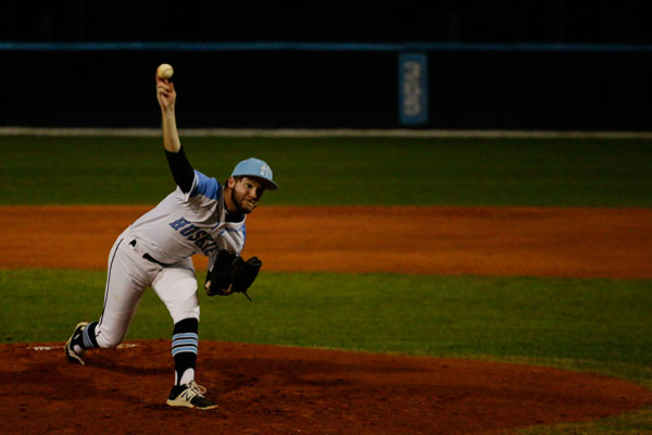 Pitcher Bailey Wendel pitches to a batter from University High School. The team won the Thursday night game,  7-3.