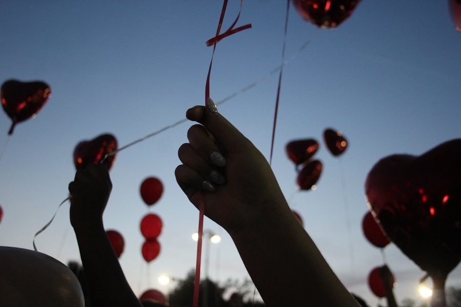 After Chris Johnsons family spoke, the crowd released red balloons.  Click below to hear the remarks of Johnsons mother at the beginning of the vigil.