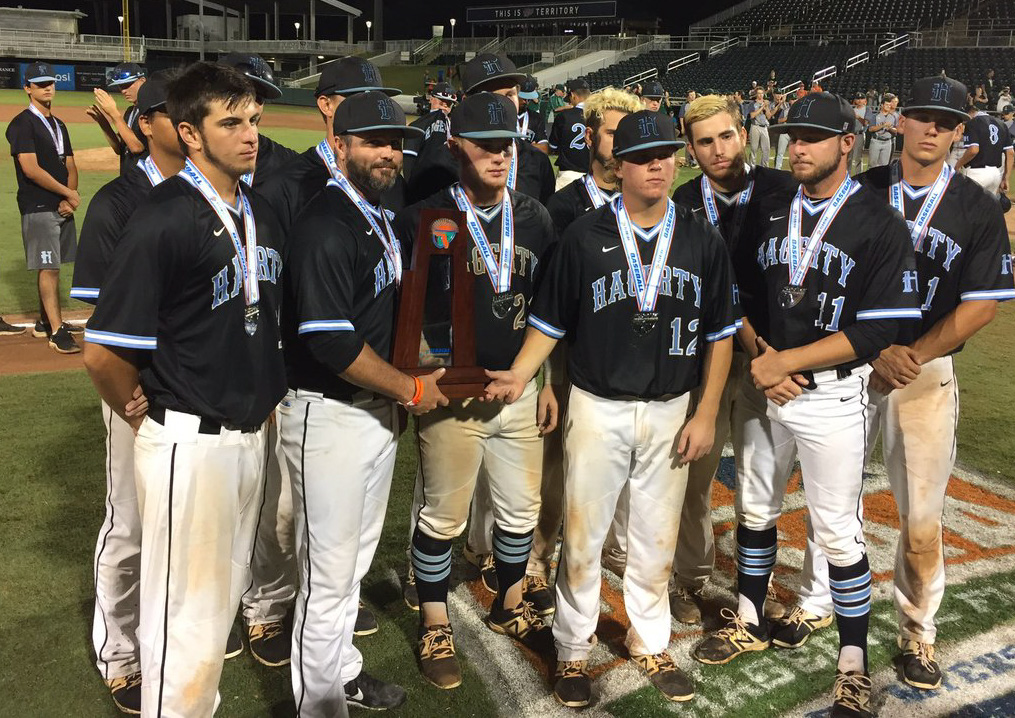 Head+coach+Matt+Cleveland+and+the+eleven+seniors+on+the+varsity+baseball+team+pose+with+the+state+runner-up+trophy.+They+were+defeated+by+Lincoln%2C+5-1.