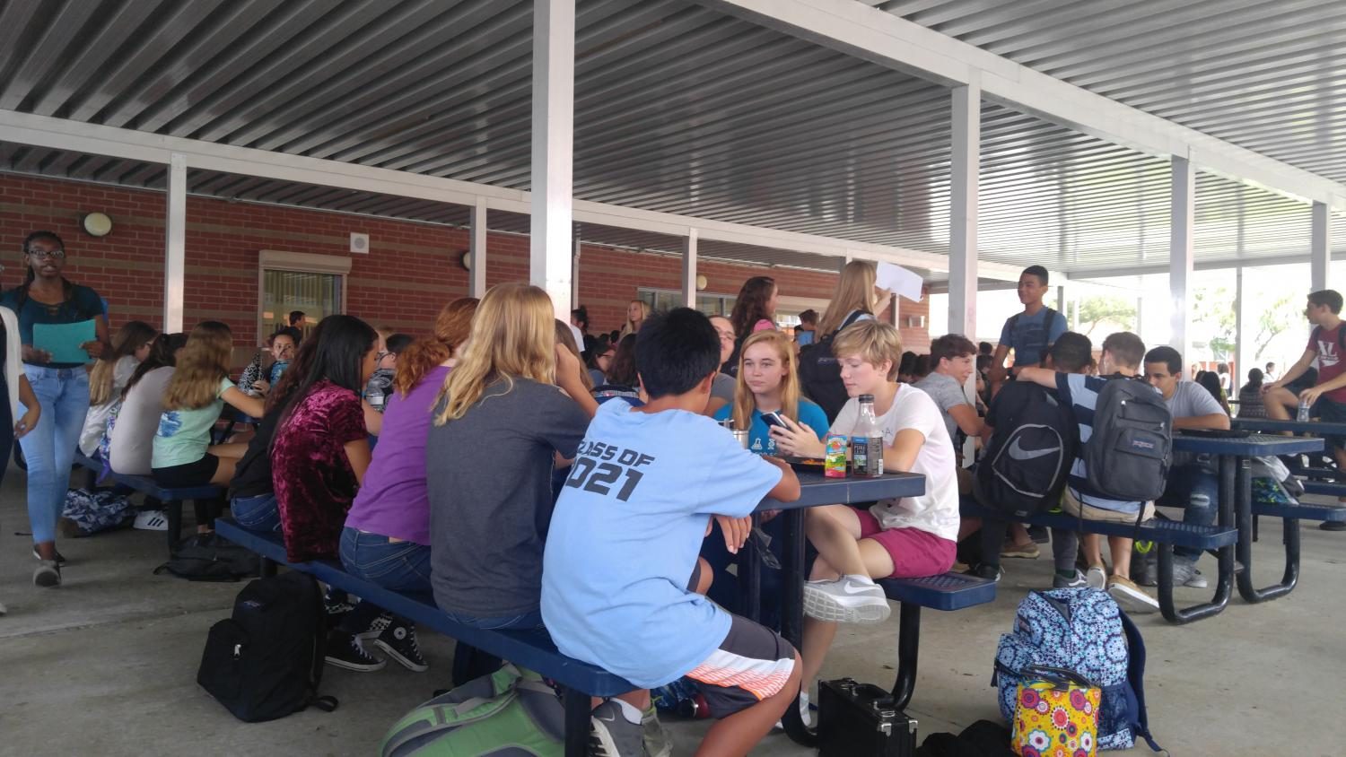 Students eat at the tables outside of the cafeteria, the only outside area where students are allowed to eat this year.