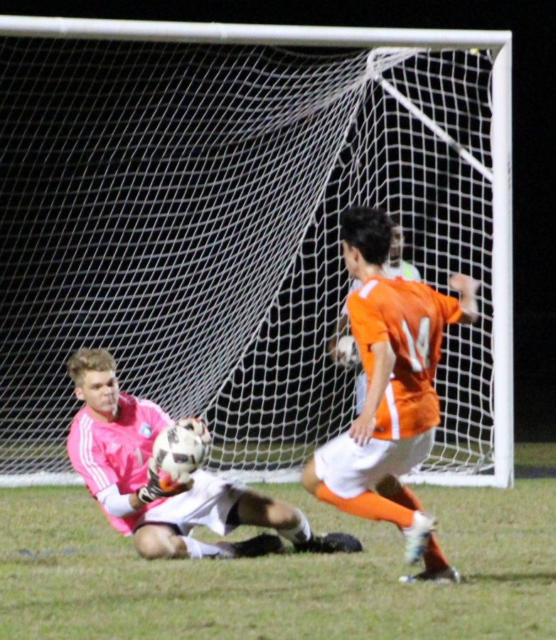 Goalie Daniel Dearolph saves a potential goal against Oviedo. He would get seven of them during the 3-1 win.