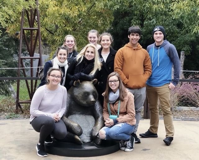 Some band members pose in front of a panda statue. They took a trip to Washington D.C. over Thanksgiving break. 