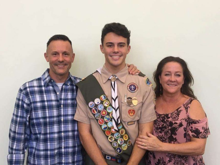 Senior Jacob Strickle poses with his parents, Jeff and Jodi Strickle. This was after being awarded the Eagle Scout. 