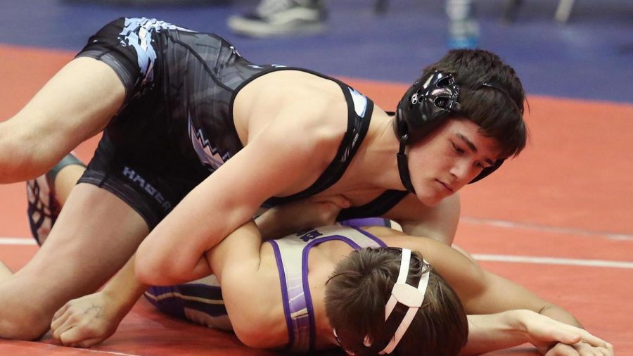 Sophomore Dylan Kohn attempts to pin his Winter Springs Opponent. Hagerty wreslted Winter Springs at the State Dual meet at Freedom High school.
photo by Stephen Dowell