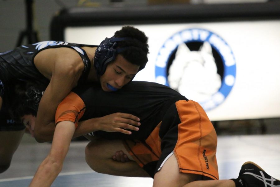 Sophmore Ethan Lopez going for the pin against Oviedo.