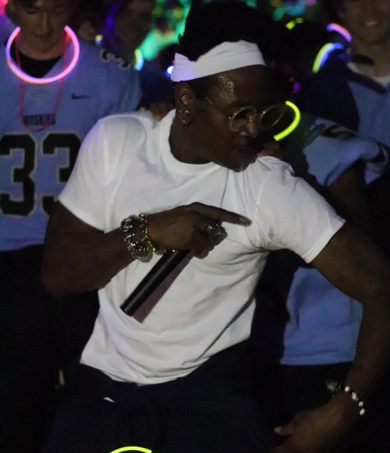 A member of the bass boyz dancing with the football team. 