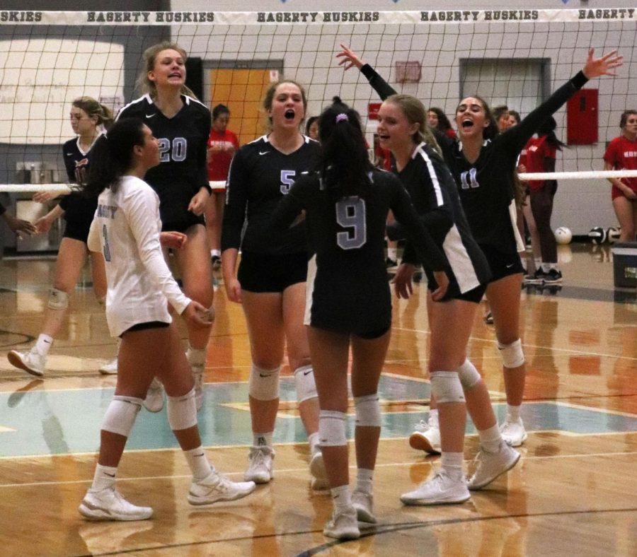 Girls varsity volleyball celebrates a five-set win against Leon on senior night on Friday, Oct. 11.  Leon, the team that beat Hagerty in the state semifinals two years ago, was ranked number one in the state before losing to Hagerty.