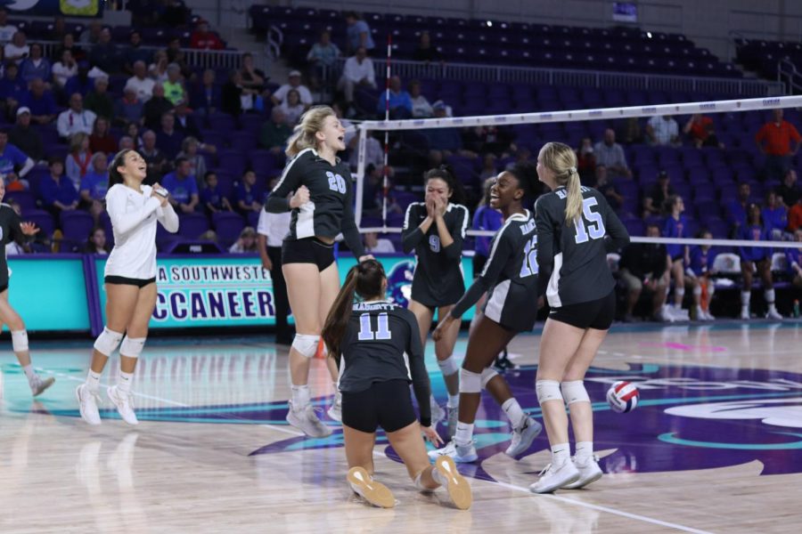 The girls volleyball team celebrates match point against Palm Beach Gardens. The team won its first state championship on Saturday, Nov. 16. 