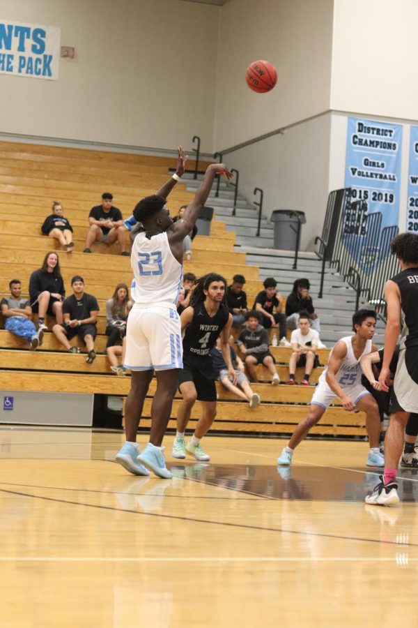 Sophomore guard Jah Nze pulling up on the top of the key vs Winter Springs. He was one of seven athletes honored at the day.