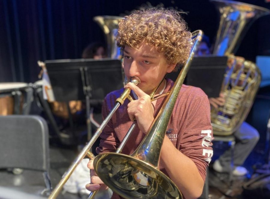 Trombone+player+Cameron+Mostecki+practices+music+he+will+play+in+Germany.+He+is+part+of+the+75-person+group+that+left+on+Saturday%2C+Dec.+14.
